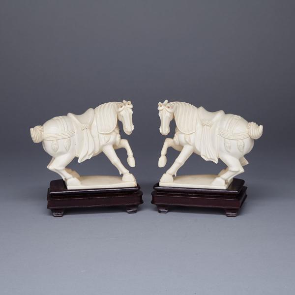 Appraisal: Pair of Small Ivory Carved Horses Rendered in the round