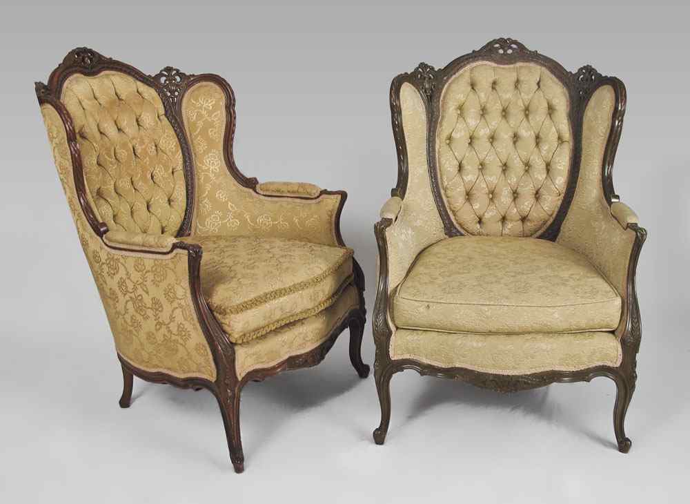 Appraisal: PAIR 'S CARVED PARLOR CHAIRS Profusely carved back hand rests