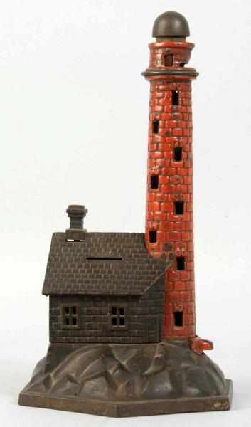 Appraisal: Cast Iron Lighthouse Mechanical Bank Description Working All original Small