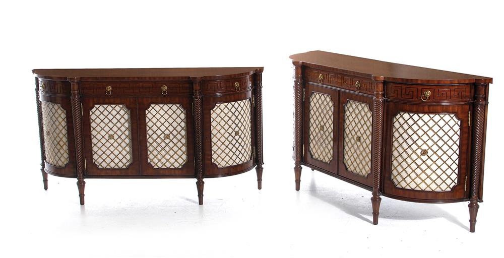 Appraisal: Pair Maitland-Smith Regency style console cabinets mahogany with brass wire-panel