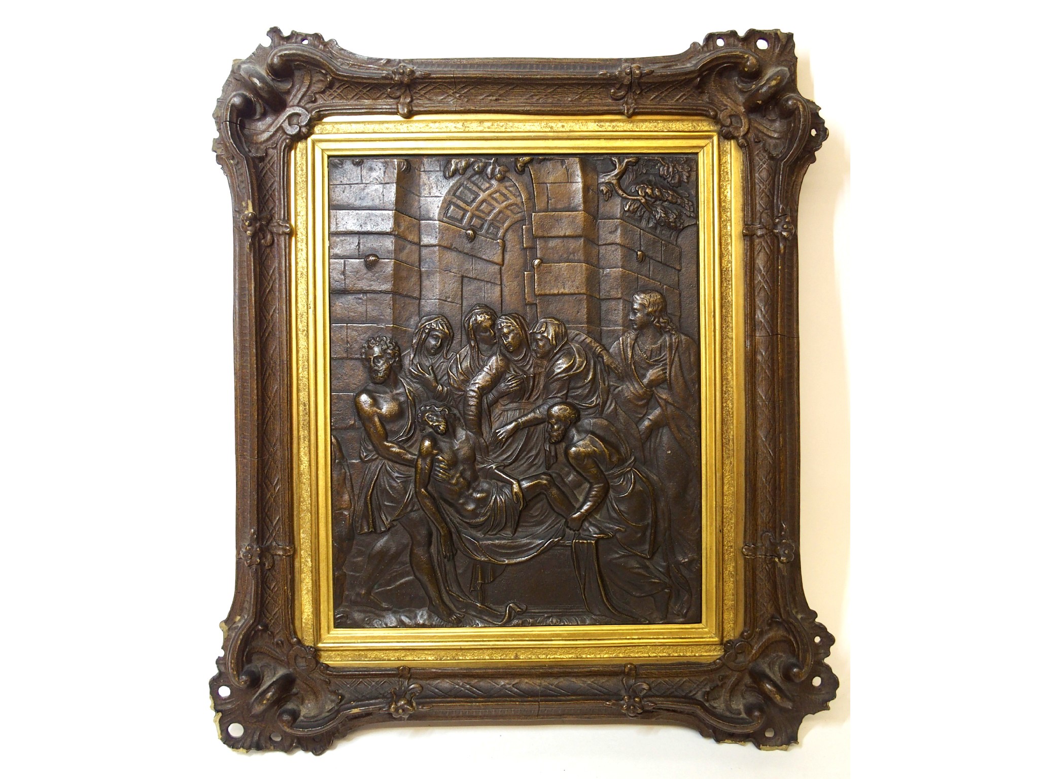 Appraisal: A patinated metal plaque depicting the Lamentationin wood frame cm