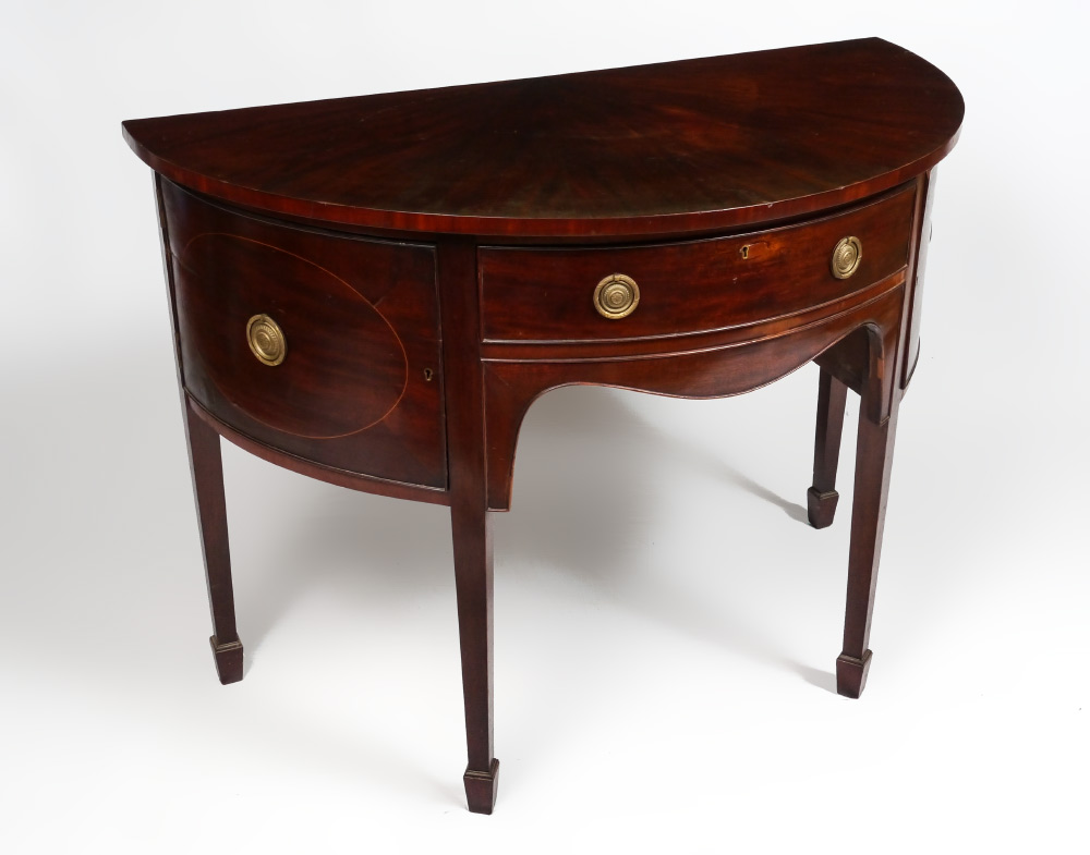 Appraisal: MAHOGANY DEMI LUNE SIDEBOARD Mahogany veneer single drawer over shaped