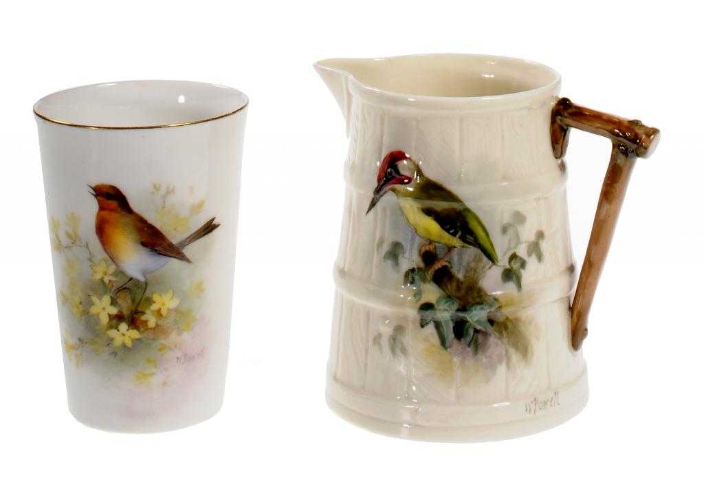 Appraisal: A ROYAL WORCESTER MOULDED JUG AND A BEAKER painted by