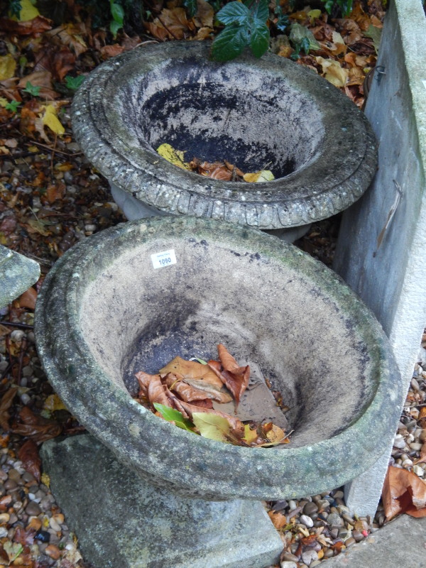 Appraisal: Two similar composition garden urns