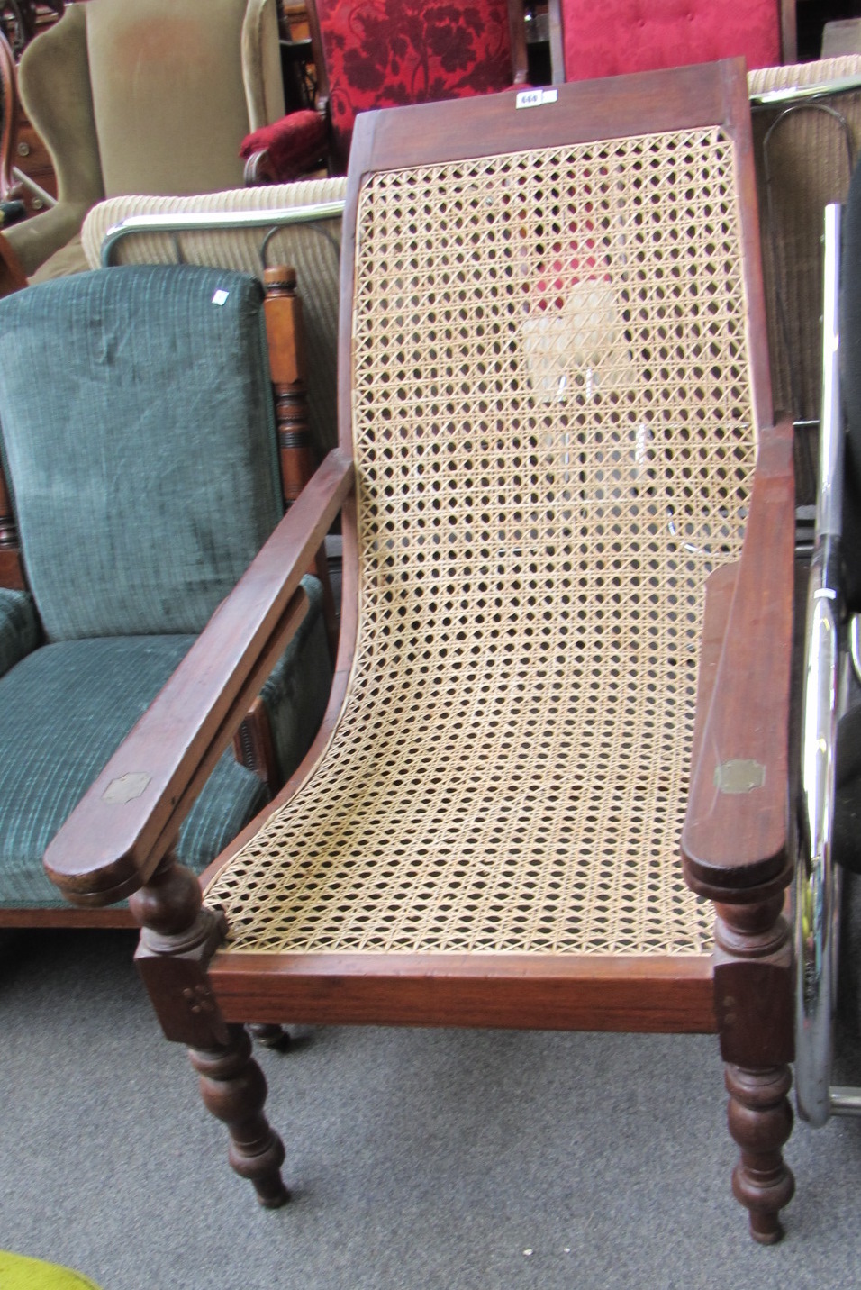 Appraisal: A hardwood framed plantation chair with cane seat and turned