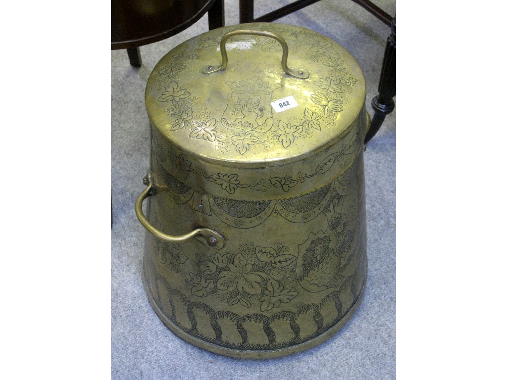 Appraisal: Large brass pot and lid with engraved and armorial decoration