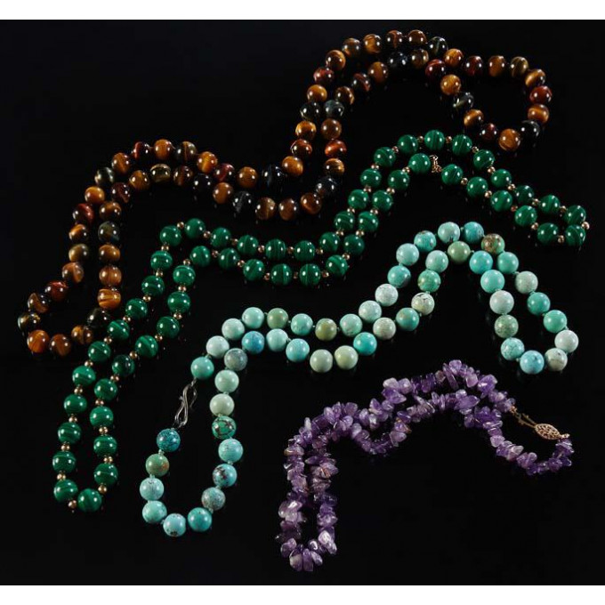 Appraisal: Group of Four Stone Bead Necklaces one of mm tiger's