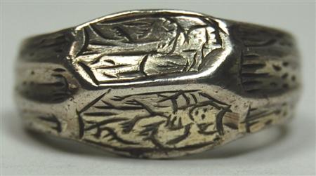 Appraisal: An antique gentleman's silver ring the bevelled front horizontally engraved