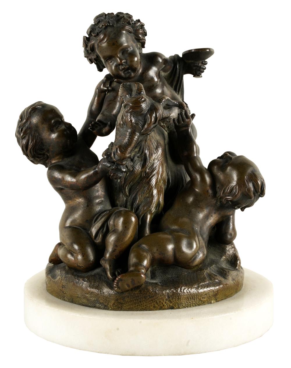 Appraisal: PUTTI PLAYING WITH GOATbronze affixed to a white marble plinth