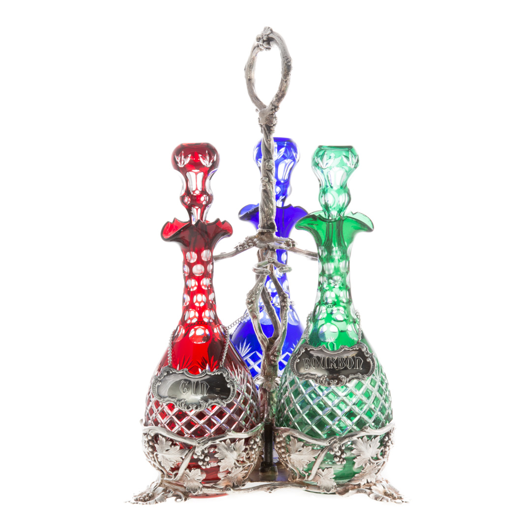 Appraisal: English silver-plated three-bottle decanter holder first half- th century tri-form