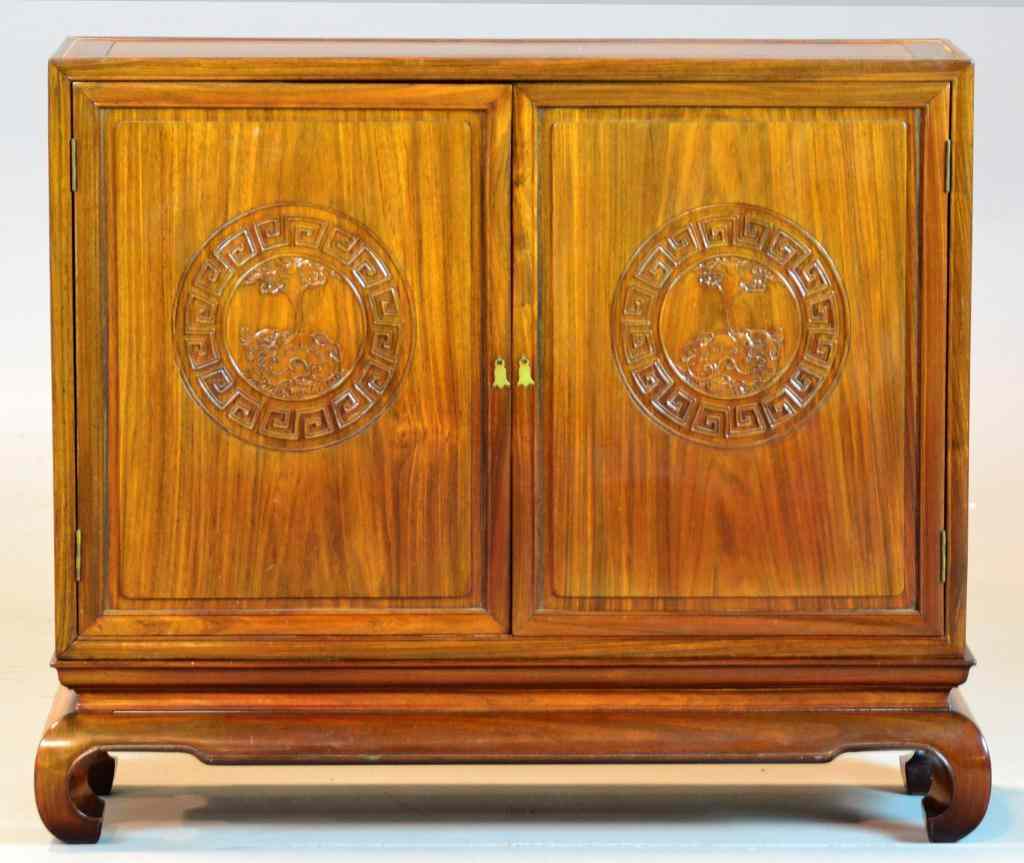 Appraisal: Chinese Rosewood CabinetHaving two doors opening to reveal two wooden