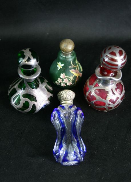 Appraisal: Four Art Nouveau coloured glass scent bottles and stoppers two