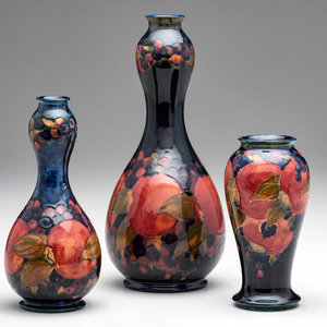 Appraisal: Moorcroft English th Century Three Vases glazed earthenware each with