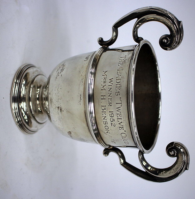 Appraisal: A SILVER TROPHY CUP with scrolling handle for the ladies