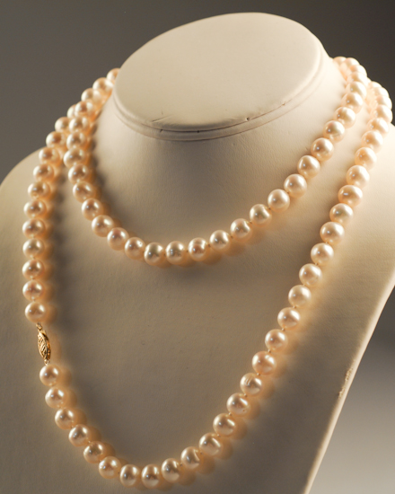 Appraisal: A Pearl Necklace with mm pearls a k gold clasp