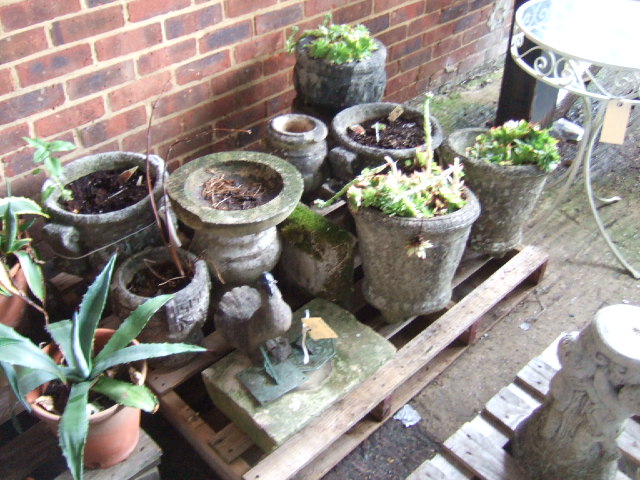 Appraisal: Nine various reconstituted stone garden planters two sundial tops a