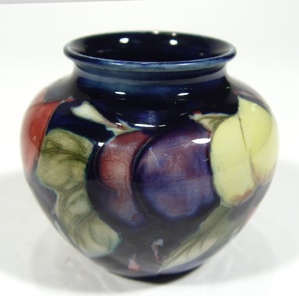 Appraisal: Miniature Moorcroft pottery vase hand painted and tubelined with wisterias