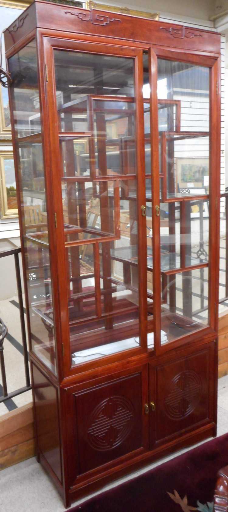 Appraisal: CHINESE ROSEWOOD AND GLASS CURIO CABINET ON CABINET Hong Kong