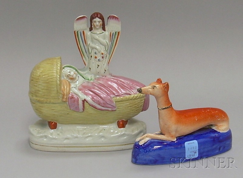 Appraisal: Two Decorative Ceramic Items a Staffordshire pottery whippet and a