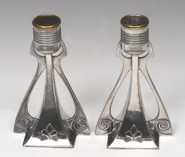 Appraisal: A PAIR OF PLATED CANDLESTICKS AFTER A DESIGN BY W