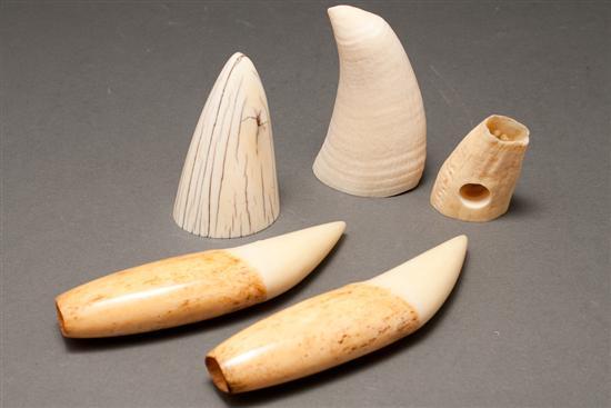 Appraisal: Pair of whale teeth two assorted whale teeth and an