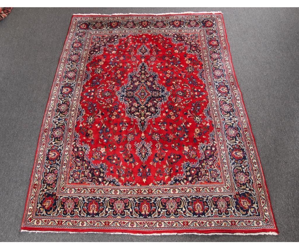 Appraisal: Kashan room size carpet with red field and floral patterns