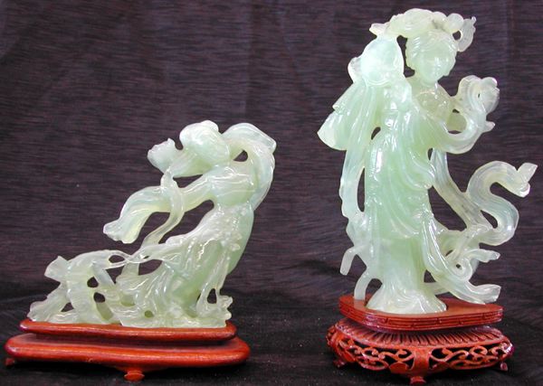 Appraisal: Two Jade Figures consisting of an elaborately carved Chinese serpentine