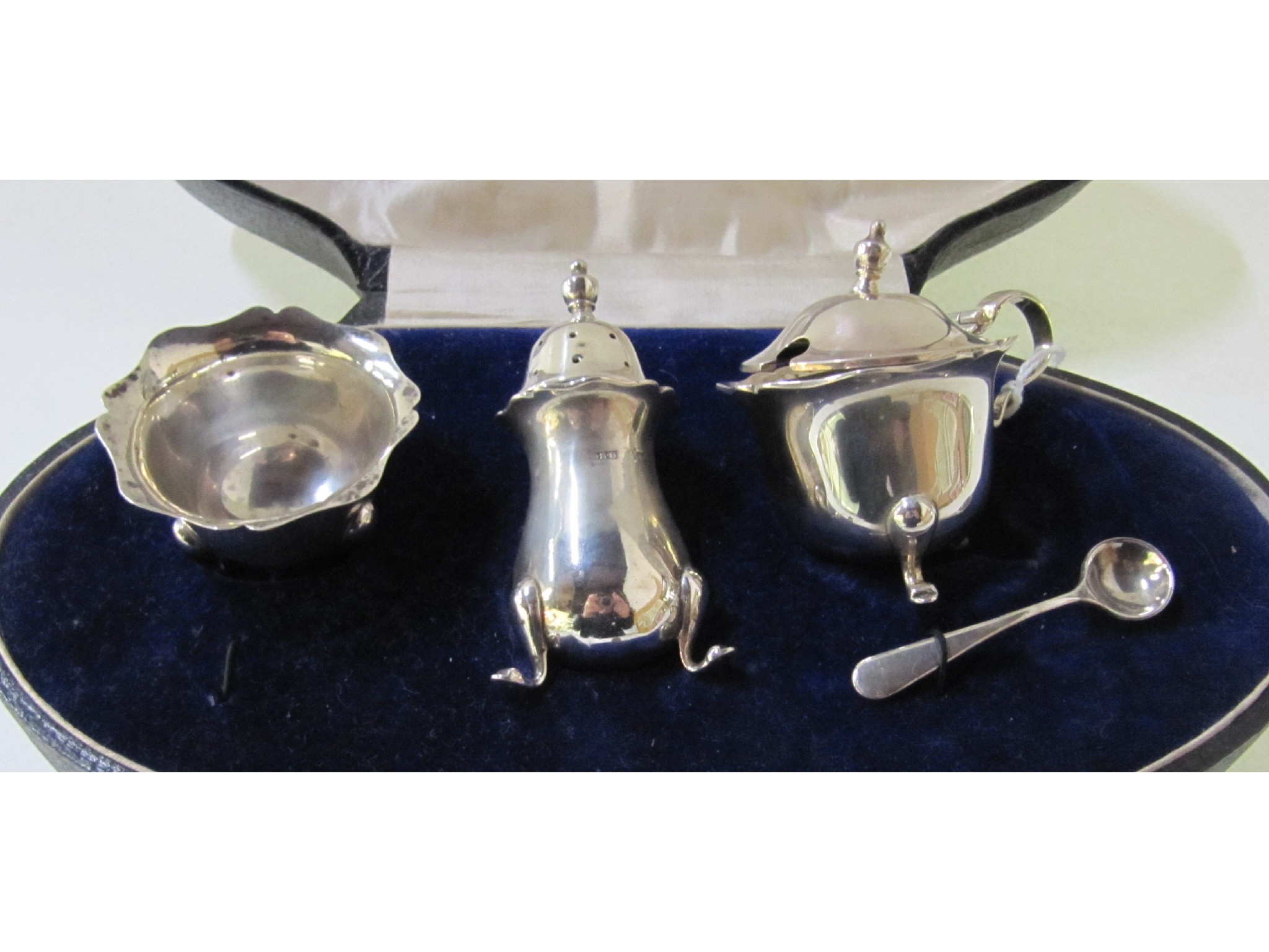 Appraisal: A cased three piece silver condiment set Birmingham