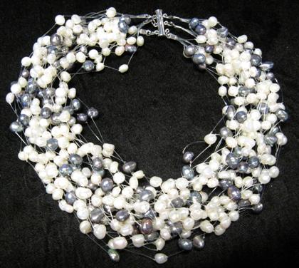 Appraisal: Invisible freshwater pearl necklaceTwenty strand black and white freshwater pearls