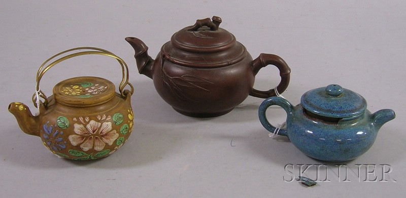 Appraisal: Three Asian Teapots bizenware with bamboo-style spout and handle blue