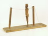 Appraisal: PRIMITIVE TOY - Dancing Man on stand in crudely carved