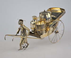 Appraisal: A Chinese 'Rickshaw' cruet set cm long