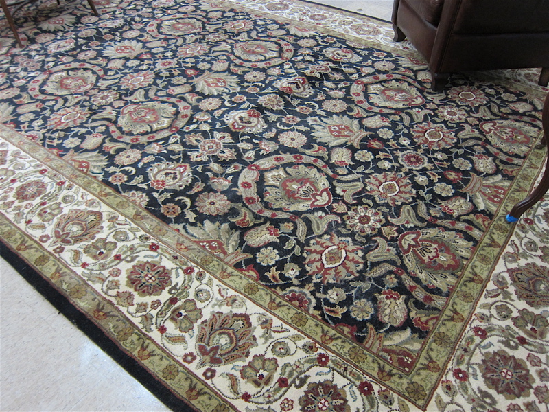 Appraisal: HAND KNOTTED ORIENTAL CARPET Indo-Persian overall floral design on black