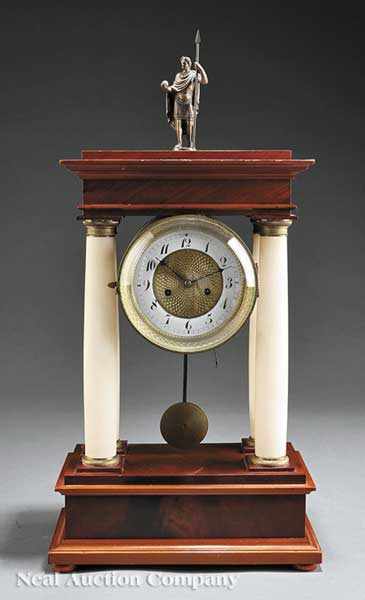 Appraisal: A Continental Mahogany and Onyx Portico Clock early th c