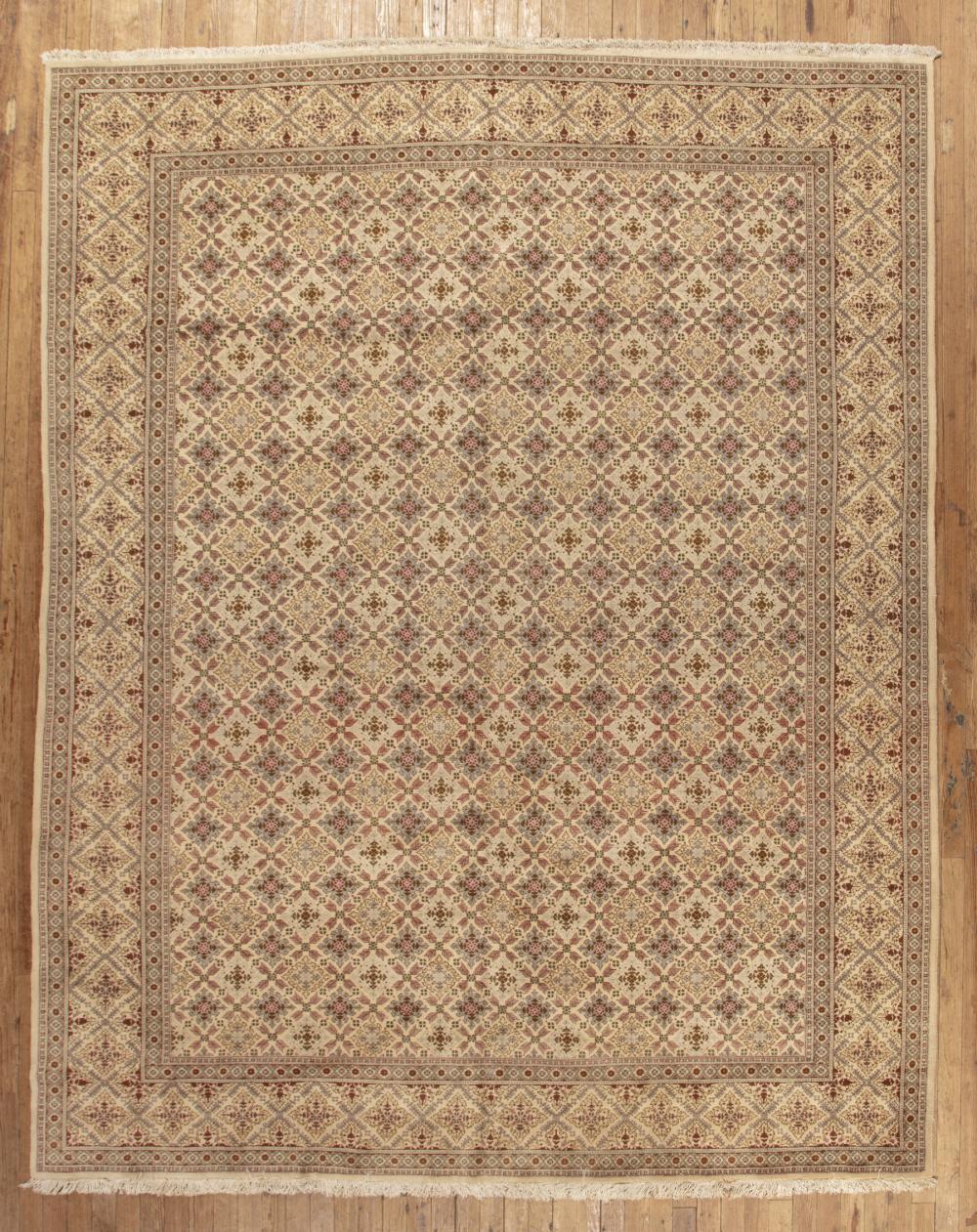 Appraisal: Tabriz Carpet khaki ground repeating floral design ft in x