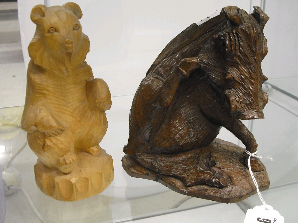 Appraisal: Black Forest carved wooden figure of a seated boar high