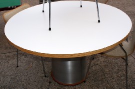 Appraisal: A modern white laminate and timber circular table with coned