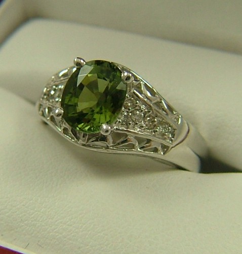 Appraisal: GREEN TOURMALINE AND DIAMOND RING The K white gold band