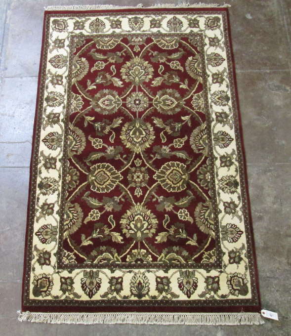 Appraisal: HAND KNOTTED ORIENTAL AREA RUG Indo-Persian overall floral design on