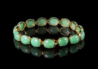 Appraisal: A Jadeite and K Gold Mounted Bracelet A Jadeite and