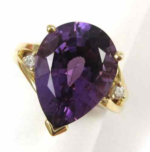 Appraisal: AMETHYST DIAMOND AND FOURTEEN KARAT GOLD RING with a round-cut