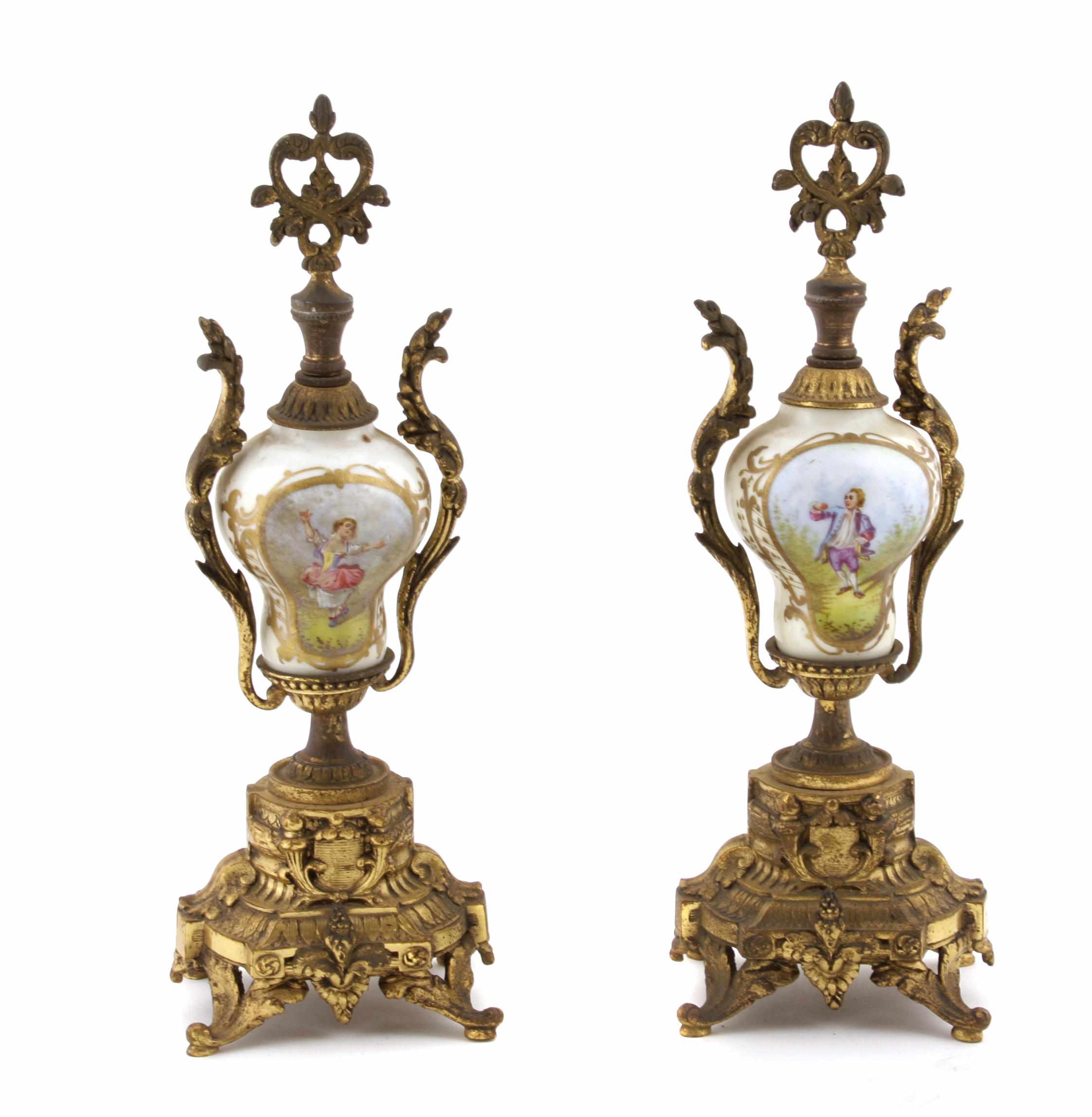 Appraisal: A pair of gilt metal mounted porcelain urns height in