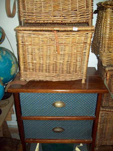 Appraisal: A COLLECTION OF FOUR CANE BASKETS AN EDWARDIAN BLOUSE CHEST