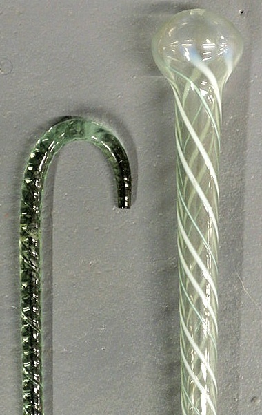 Appraisal: Two glass canes th c hollow pale green with white