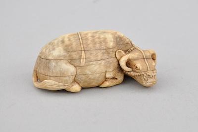 Appraisal: Recumbent Ox Netsuke Carved ivory ox with detailed rope harness