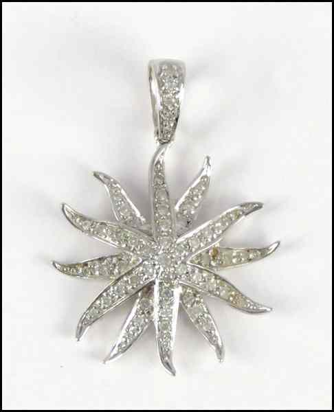 Appraisal: KARAT WHITE GOLD AND DIAMOND STARBURST PENDANT grams Condition No