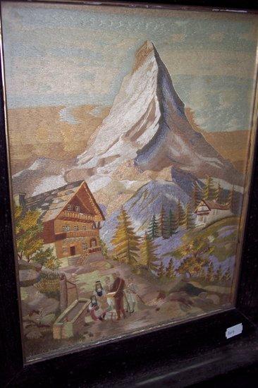 Appraisal: A needlework picture depicting a Tyrolean scene with figures in