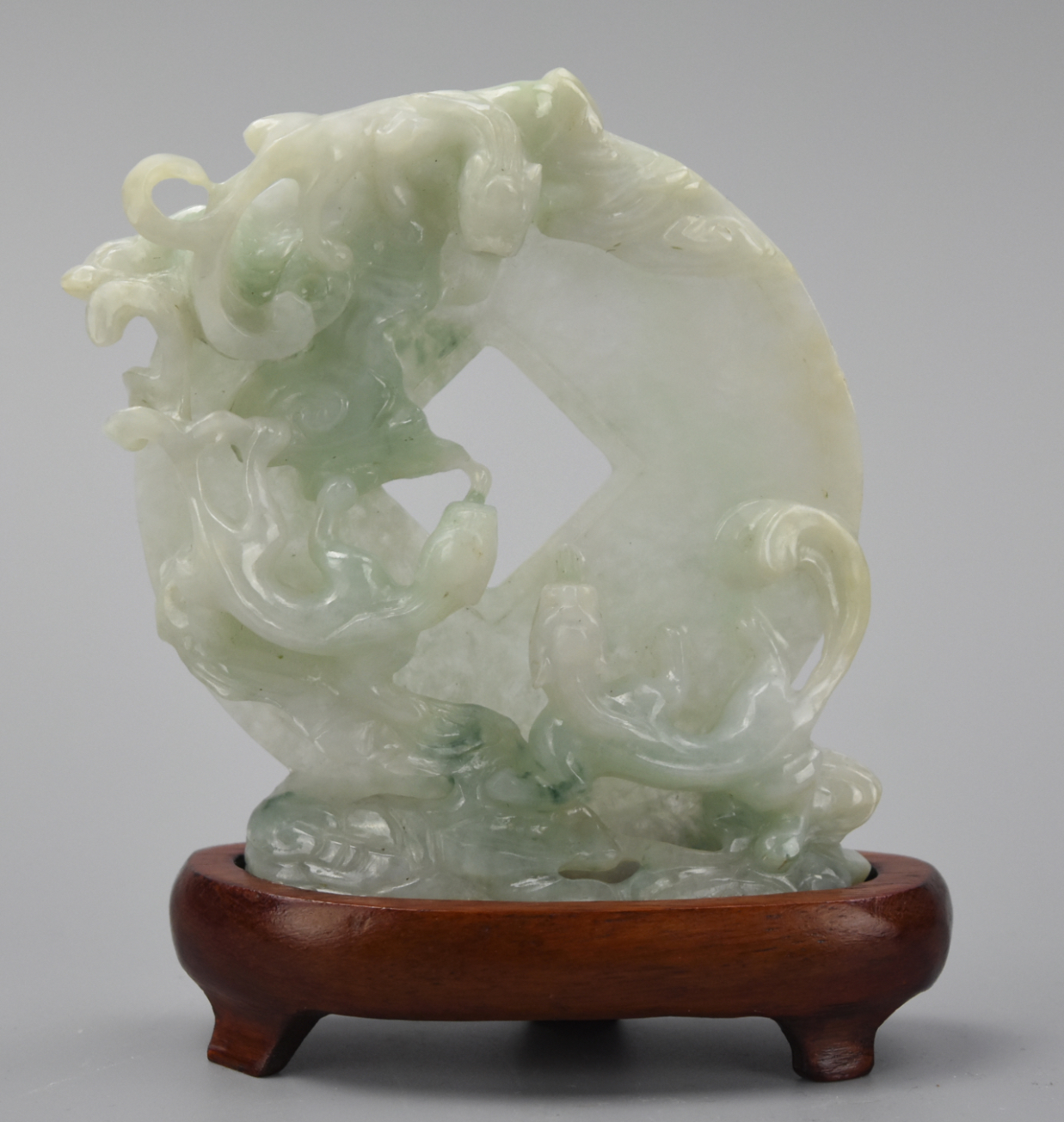 Appraisal: JADEITE CARVING OF CHI-DRAGON W CHINESE COIN A Jadeite carving