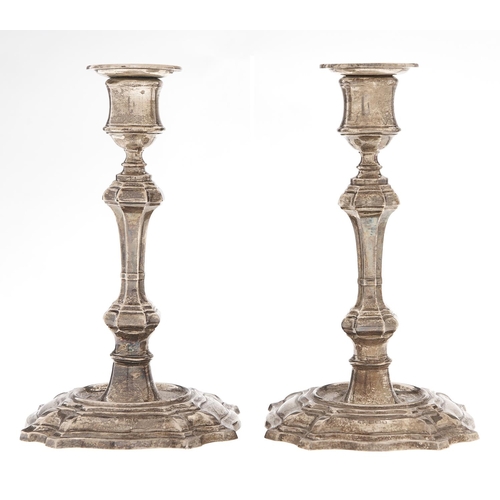 Appraisal: A pair of George V silver candlesticks in George II