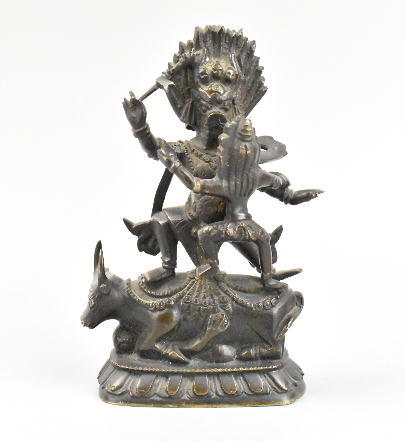 Appraisal: A Tibetan bronze guardian statue The guardian stands firmly on